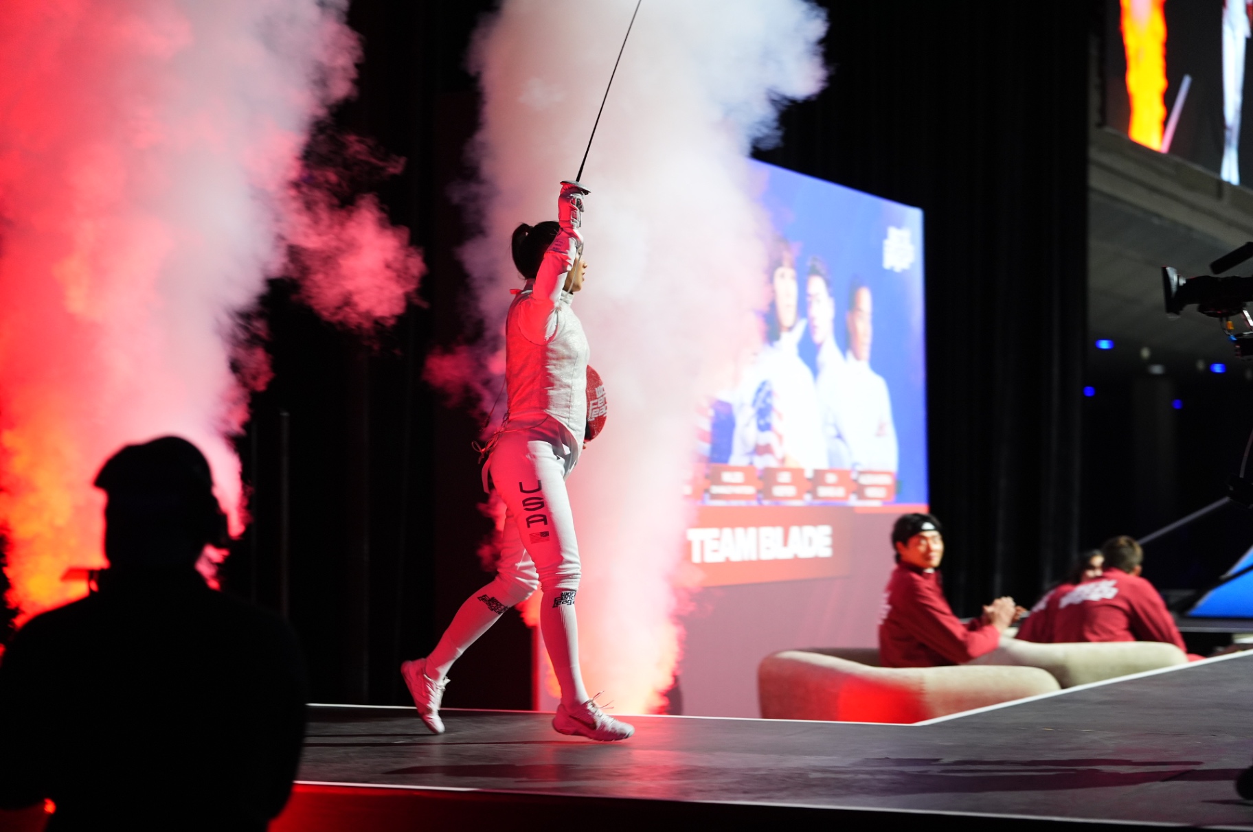 Blade Collective athletes in red walking out at a WFL event.